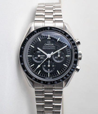 Omega Speedmaster Moonwatch referance 310.30.42.50.01.001 Hesalite crystal black dial chronograph stainless steel men's watch front of the watch for sale by Belmont Watches in San Diego