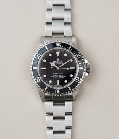 Rolex Submariner 14060M 'Scrambled Engraved' 4-Liner