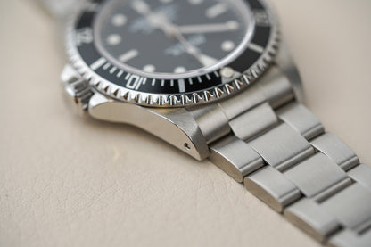Rolex Submariner 14060M 'Scrambled Engraved' 4-Liner