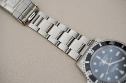 Rolex Submariner 14060M 'Scrambled Engraved' 4-Liner